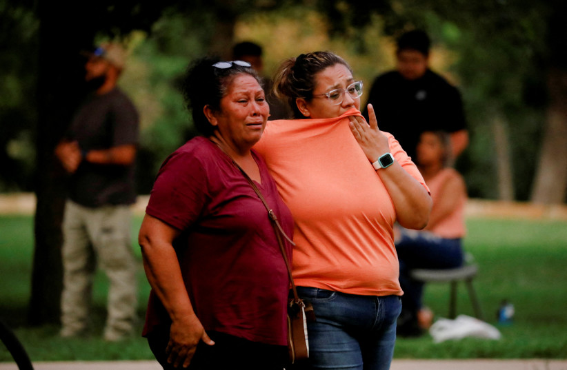  People react outside the Ssgt Willie de Leon Civic Center, where students had been transported from Robb Elementary School after a shooting, in Uvalde, Texas, US, May 24, 2022.  (photo credit: REUTERS/MARCO BELLO)