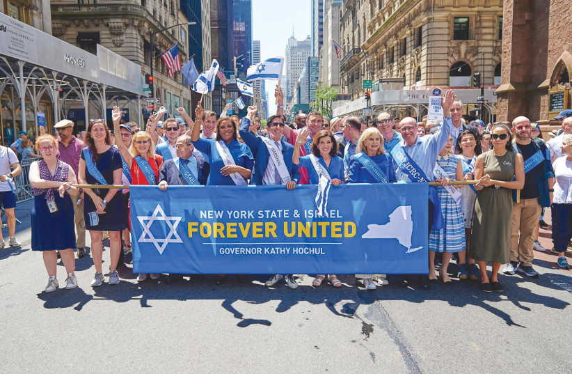 PARTICIPANTS AT the Celebrate Israel Parade include the author, the grand marshal of the event, at the front and center flanked by the governor of the State of New York Kathy Hochul to the immediate right and state Attorney-General Letitia James to the immediate left.  (photo credit: PERRY BINDELGLASS)