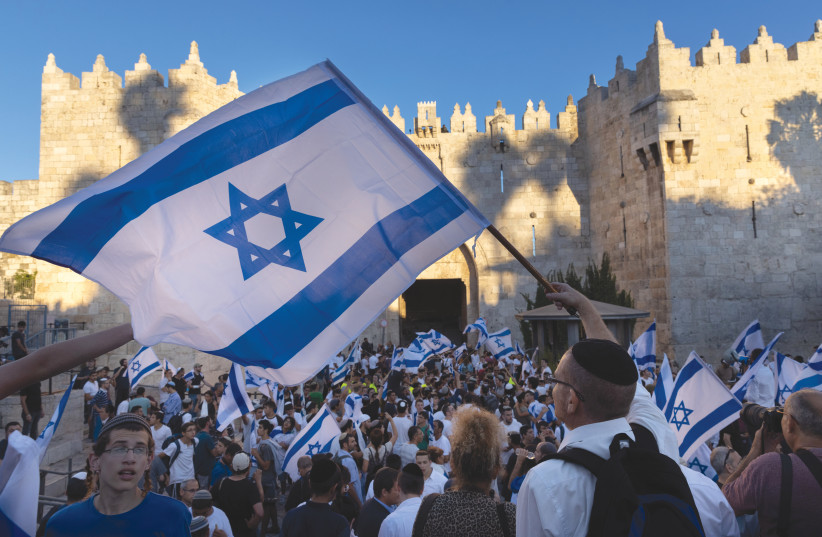  A SCENE FROM the annual Jerusalem Day Flag March outside Damascus Gate in the Old City, last year. (photo credit: OLIVIER FITOUSSI/FLASH90)