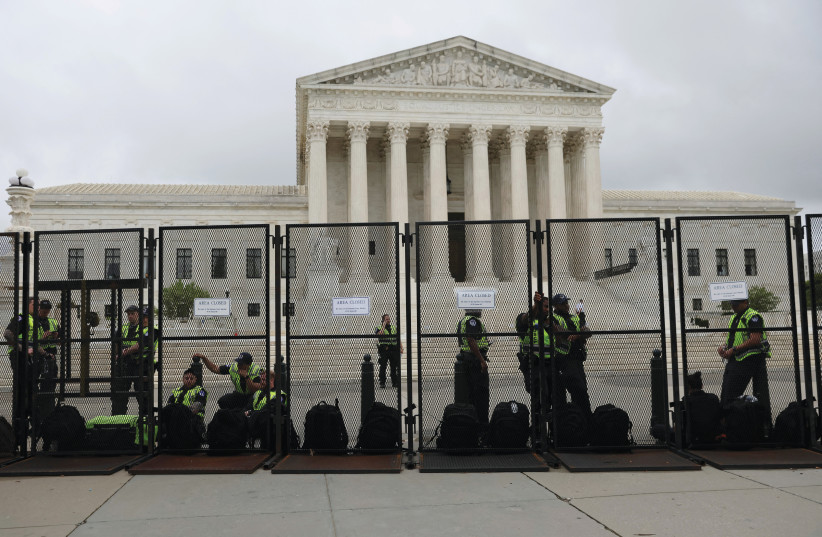  LAW ENFORCEMENT stands guard at the US Supreme Court after an abortion rights rally, Washington, May 14. (credit: Leah Mills/Reuters)