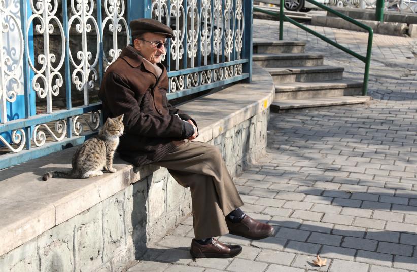  AN ELDERLY man gets some fresh air in Tehran. (photo credit: Atta Kenare/AFP via Getty Images)