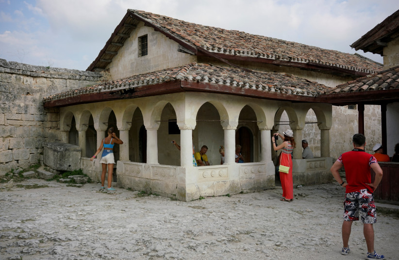  TOURISTS VISIT a Karaite prayer house (‘kenesa’) in the ancient town of Chufut-Kale near Bakhchisaray, Crimea. (photo credit: MAXIM ZMEYEV/REUTERS)