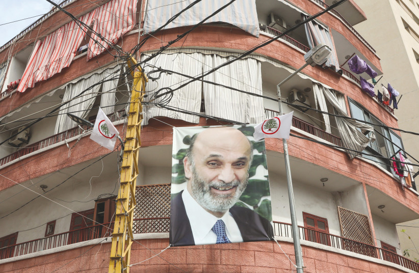  A BANNER depicting Samir Geagea, leader of Lebanon’s Christian Lebanese Forces party, is seen on a building in a Christian neighborhood in Beirut last week. (photo credit: MOHAMED AZAKIR/REUTERS)