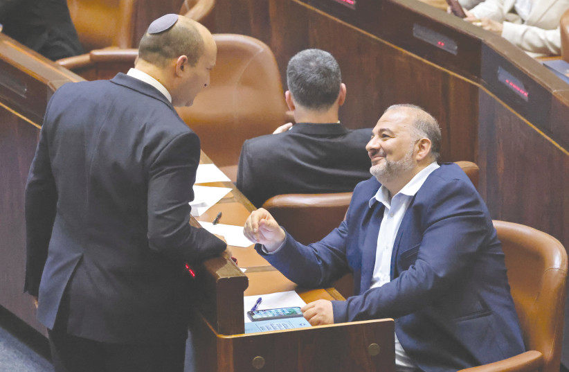  NAFTALI BENNETT and Mansour Abbas in the Knesset. Is a partnership like this lost for good?  (photo credit: Emmanuel Dunand/AFP via Getty Images)