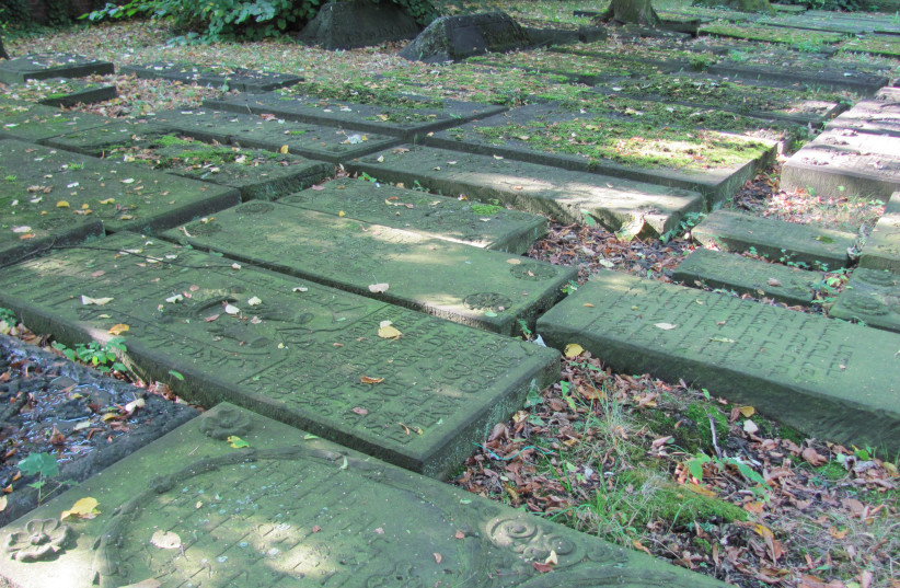  Headstones of Sephardic Jews lie on the ground at the Altona cemetery in Hamburg, Germany. (photo credit: Wikimedia Commons)