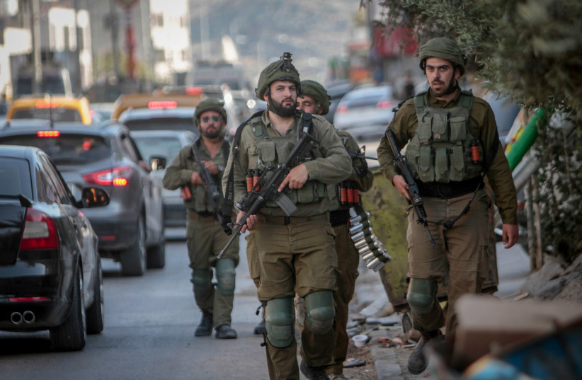  Israeli reserve soldiers patrol in the West Bank village of Hawara, near Nablus, May 26, 2022 (credit: NASSER ISHTAYEH/FLASH90)