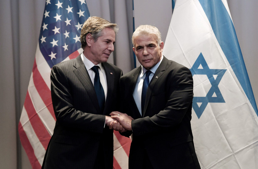 US Secretary of State Antony Blinken meets with Israeli Foreign Minister Yair Lapid in Riga, Latvia, March 7, 2022. (credit: OLIVIER DOULIERY/POOL VIA REUTERS)