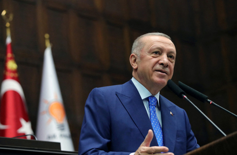 Turkish President Tayyip Erdogan addresses members of his ruling AK Party (AKP) during a meeting at the parliament in Ankara, Turkey, May 18, 2022. (photo credit: MURAT CETINMUHURDAR/PRESIDENTIAL PRESS OFFICE/HANDOUT VIA REUTERS)