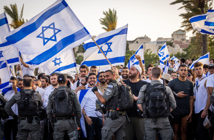  Thousands of Jews wave Israeli flags as they celebrate Jerusalem Day by dancing at Damascus Gate in Jerusalem's Old City, during Jerusalem Day, May 29, 2022 (photo credit: NATI SHOHAT/FLASH90)