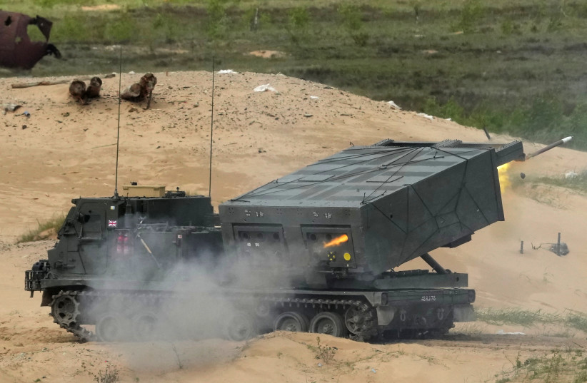  The British army's M270 Multiple Launch Rocket System (MLRS) fires during Summer Shield 2022 military exercise in Adazi military base, Latvia May 27, 2022 (photo credit: REUTERS/INTS KALNINS)