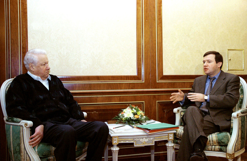  Russian President Boris Yeltsin (L) listens to his chief-of-staff Valentin Yumashev (photo credit: VIA REUTERS)