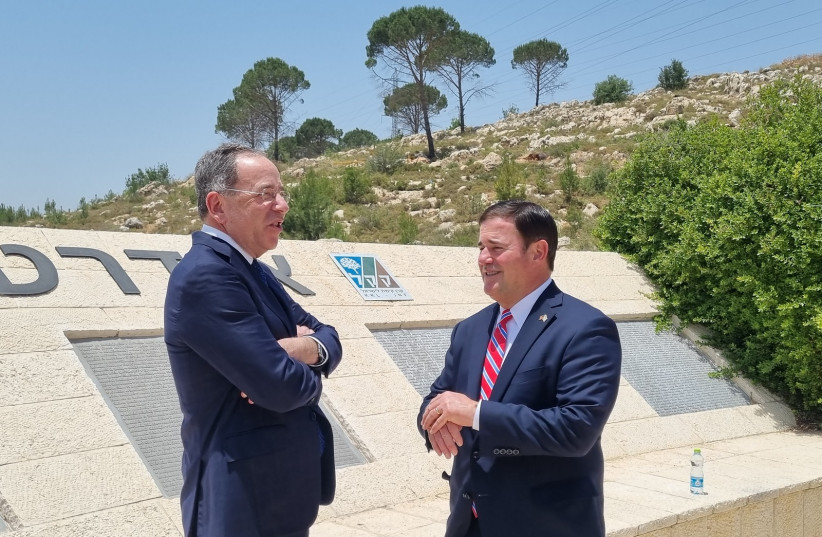 US Ambassador to Israel Thomas Nides (left) speaks with Arizona Gov. Doug Ducey at the 9/11 Living Memorial in Arazim Valley, Jerusalem, May 30, 2022. (credit: MAYA MARGIT/THE MEDIA LINE)