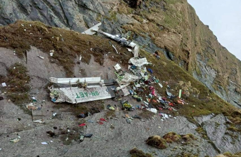  A general view of a Tara Air plane crash site during the rescue operation at Thasang, Nepal May 30, 2022. (credit: Captain Nikalas Fjellgren/Handout via REUTERS)