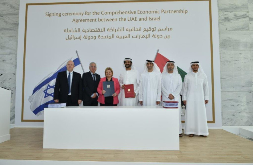  Economy Minister Orna Barbivai and UAE counterpart Abdulla bin Touq Al Marri sign a free trade deal, May 31, 2022 (credit: ANUJ TAYLOR/STRAP STUDIOS)