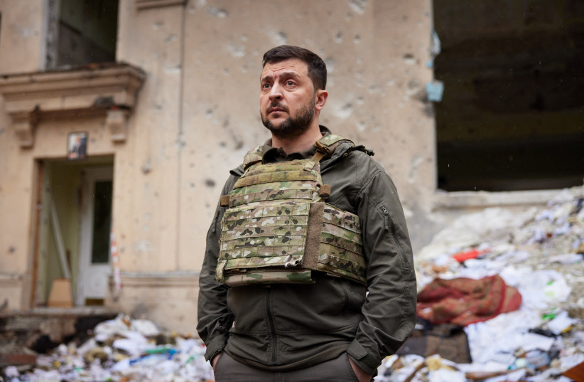 Ukraine's President Volodymyr Zelensky visits an area damaged by Russian military strikes, as Russia's attack on Ukraine continues, in Kharkiv, Ukraine May 29, 2022. (credit: Ukrainian Presidential Press Service/Handout via REUTERS)