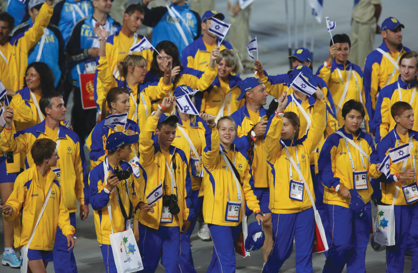  THE UKRAINE delegation attends the Maccabiah opening ceremony in Jerusalem, 2013. After the 2017 games, last year’s event was postponed due to COVID. Ukraine’s team of 40 will be part of 10,000 athletes in Israel next month. (photo credit: YONATAN SINDEL/FLASH90)