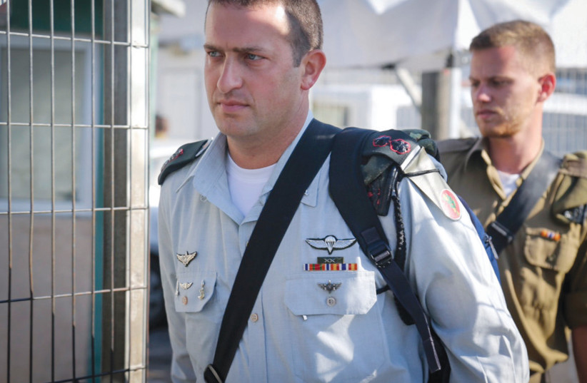  LT.-COL. DAVID SHAPIRA arrives at the Jaffa Military Court in 2016. Shapira testified that he doubted that Elor Azaria, a soldier under his command, was in danger when Azaria killed a terrorist in Hebron who was already shot and lying on the ground.  (photo credit: FLASH90)