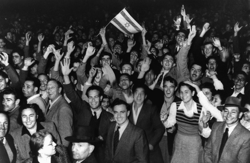   JEWS CELEBRATE in Tel Aviv moments after the UN voted to partition Mandatory Palestine, on November 29, 1947. There is little doubt that Judaism would have withered had it not been for the establishment of a Jewish state, says the writer.  (photo credit: REUTERS)