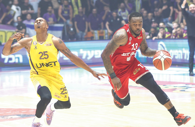  KC Rivers (right) and Hapoel Jerusalem were able to pull off a season-saving 75-61 road victory over Tyrus McGree (left) and Hapoel Holon in the local semifinals. (photo credit: DANNY MARON)
