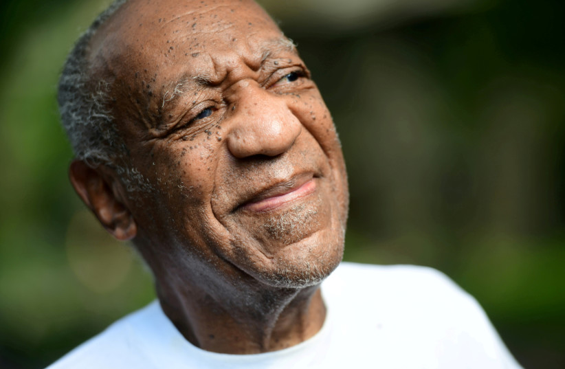  Bill Cosby looks on outside his house after Pennsylvania's highest court overturned his sexual assault conviction and ordered him released from prison immediately, in Elkins Park, Pennsylvania, US June 30, 2021. (photo credit: REUTERS/MARK MAKELA)