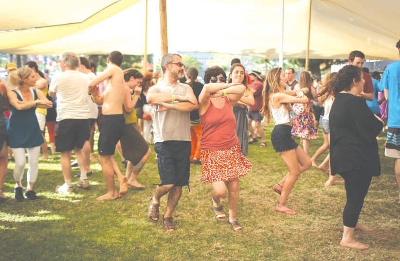 ATTENDEES DANCE to a live performance during a past Jacob's Ladder Folk Festival. (photo credit: HADAS PARUSH/FLASH90)