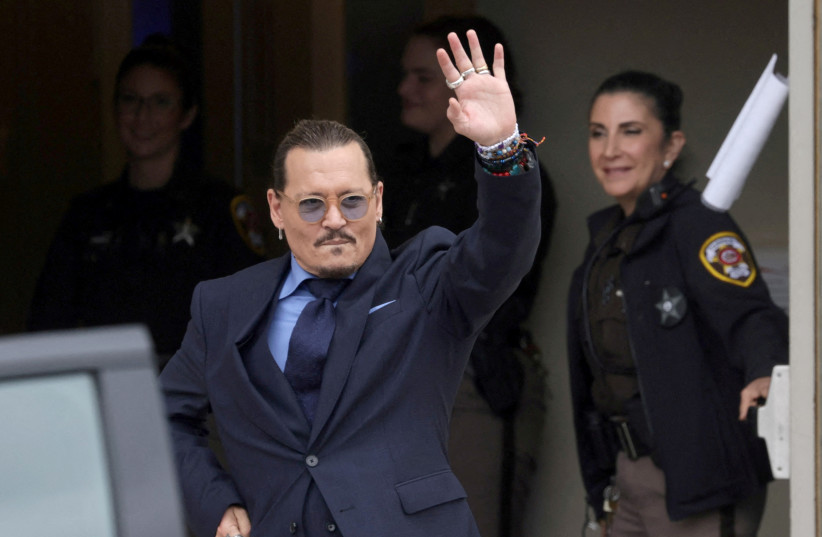  Actor Johnny Depp gestures as he leaves the Fairfax County Circuit Courthouse following his defamation trial against his ex-wife Amber Heard, in Fairfax, Virginia, U.S., May 27, 2022.  (photo credit: REUTERS/Evelyn Hockstein/File Photo)
