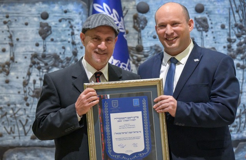  Gabriel Emanuel receives the award from Prime Minister Naftali Bennett. (photo credit: GPO)