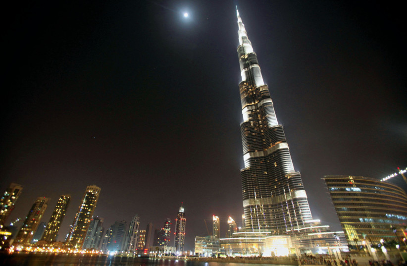  The Burj Khalifa lit up at night (photo credit: MOHAMMED SALEM/REUTERS)