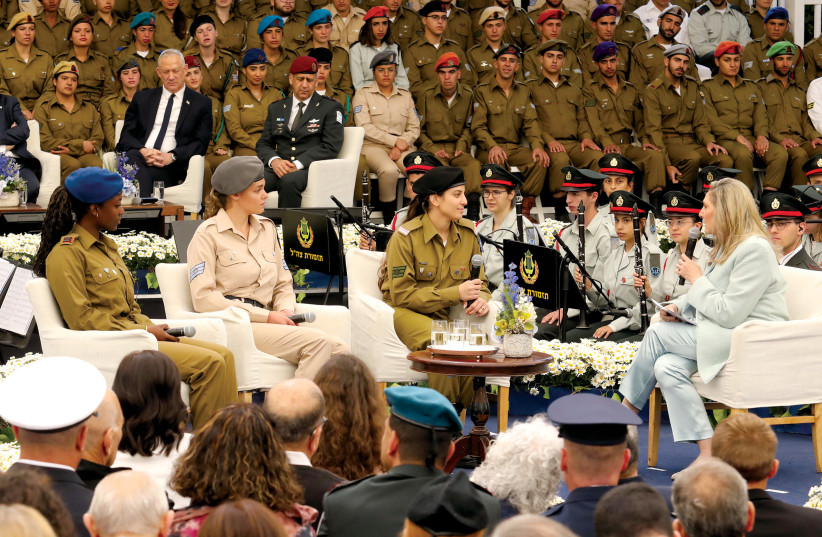  Lone soldier Bianca Martin (center), who made aliyah from South Africa and was one of 120 outstanding soldiers recognized by the IDF, is interviewed by Michal Herzog on Independence Day at the President’s Residence. (credit: MARC ISRAEL SELLEM)