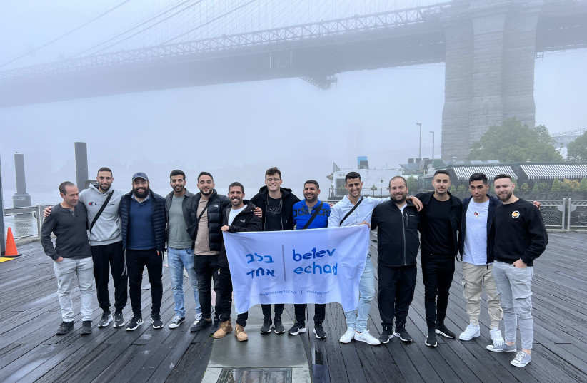  THE MAY 2022 Belev Echad delegation pose in front of the Brooklyn Bridge, on May 15, 2022. (photo credit: BELEV ECHAD)