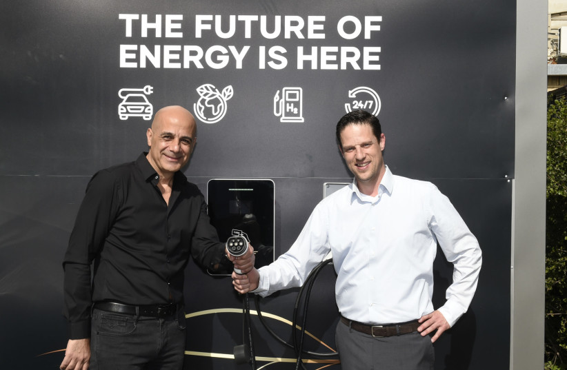  Right to left: EV Motors Chairman Ohad Seligman and CEO and Founder of GenCell Rami Reshef next to a hybrid charging station for electric cars. (photo credit: EV MOTORS)
