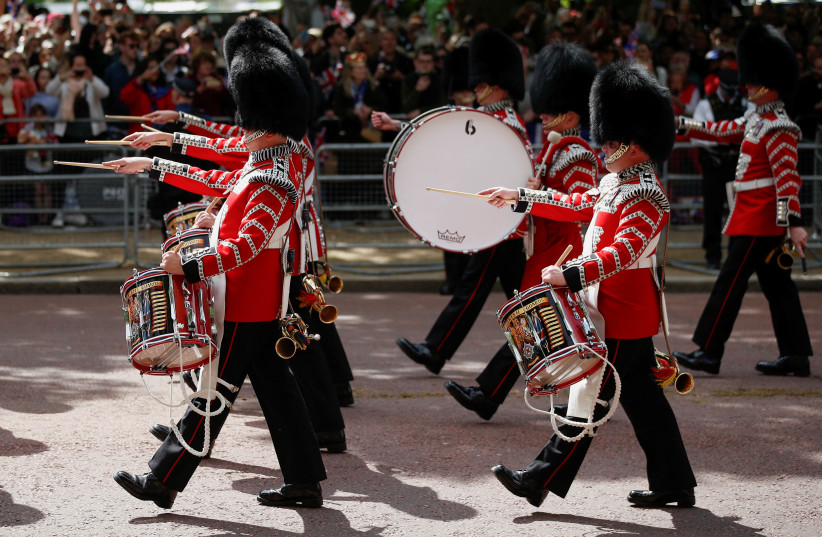  Members of the Household Division march during the celebration of Britain's Queen Elizabeth's Platinum Jubilee, in London, Britain, June 2, 2022. (photo credit: REUTERS/PETER NICHOLLS)
