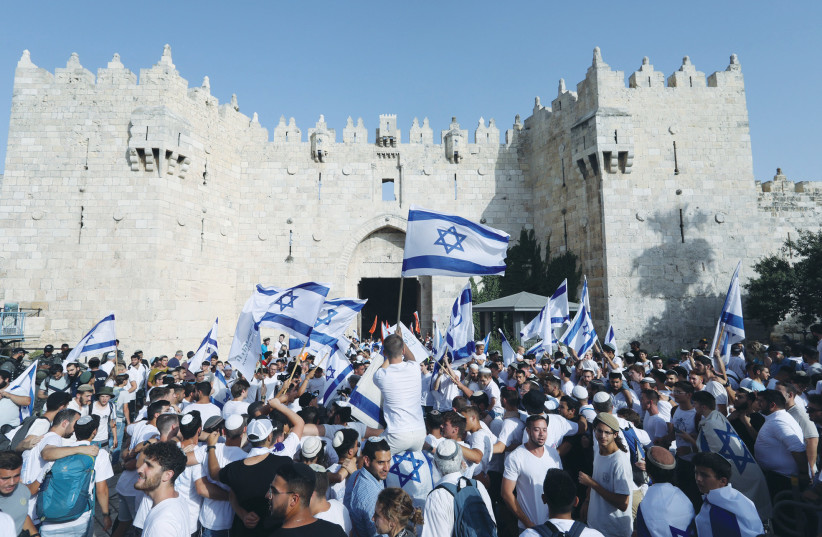  CELEBRANTS MARCH on Jerusalem Day toward the Old City. No mention was made of the myriads like us who were there to celebrate our pride in, and love for, Jerusalem, write the authors. (credit: MARC ISRAEL SELLEM)