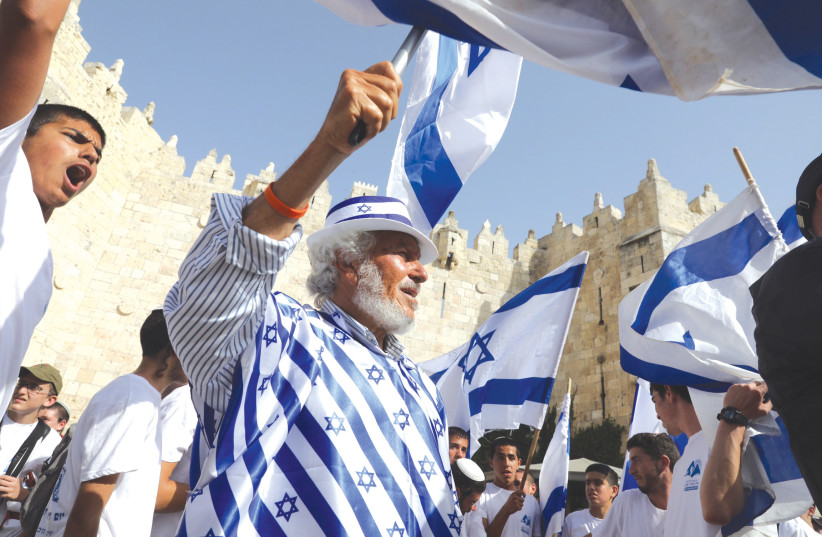  PARTICIPANTS IN this week’s Jerusalem Day Flag March demonstrably pass through Damascus Gate into the Old City.  (photo credit: MARC ISRAEL SELLEM)
