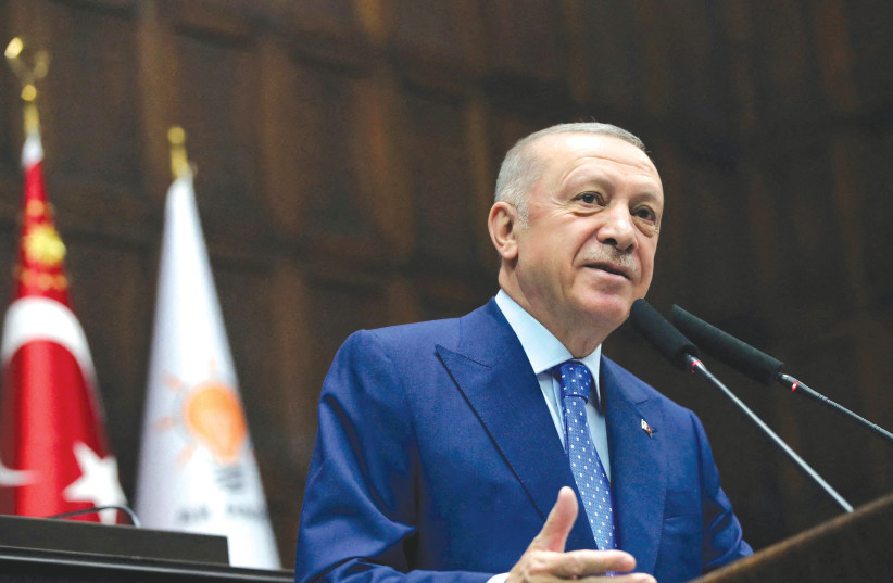  TURKISH PRESIDENT RECEP Tayyip Erdogan addresses members of his ruling AK Party (AKP) in Ankara last month. (photo credit: MURAT CETINMUHURDAR/PRESIDENTIAL PALACE/REUTERS)