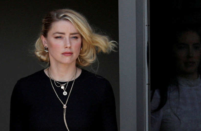  Amber Heard leaves Fairfax County Circuit Courthouse after the jury announced split verdicts in the Depp v. Heard civil defamation trial at the Fairfax County Circuit Courthouse in Fairfax, Virginia, US, June 1, 2022. (photo credit: REUTERS/TOM BRENNER)