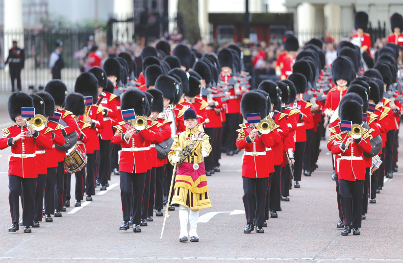  MEMBERS OF the Royal Guard take part in the Trooping the Color parade at Buckingham Palace, during celebrations for Britain’s Queen Elizabeth’s Platinum Jubilee, in London, yesterday.  (photo credit: REUTERS/CHRIS JACKSON)