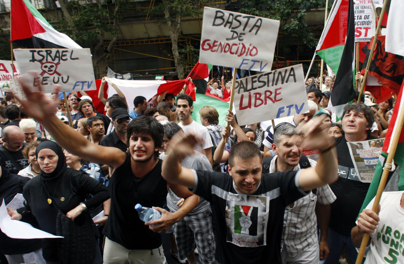  People protest during a demonstration against Israel's offensive on Gaza outside the Israeli Embassy in Buenos Aires, January 6, 2009 (photo credit: REUTERS/MARCOS BRINDICCI)
