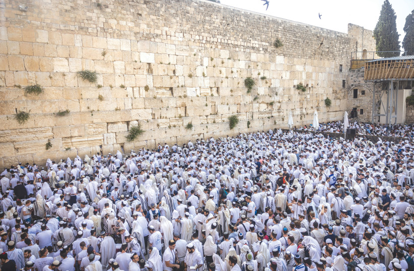  JEWS PRAY at the Western Wall on Jerusalem Day. The Kotel is the most visited site in Israel, according to the Tourism Ministry. (photo credit: YONATAN SINDEL/FLASH90)