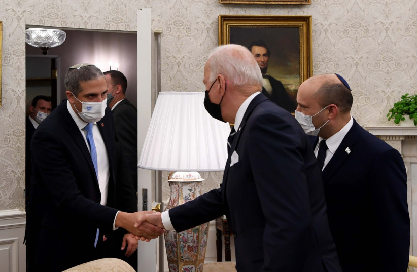  Naftali Bennett's Chief of Staff Tal Gan-Zvi shakes hands with President Joe Biden in the Oval Office in August 2021. (credit: GPO)