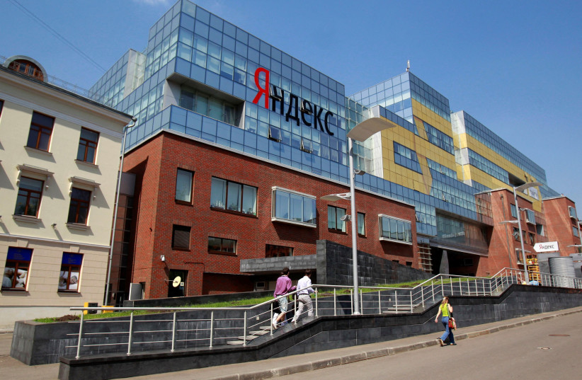 People walk near the headquarters of Yandex company in Moscow, May 23, 2011. (photo credit: REUTERS/SERGEI KARPUKHIN/FILE PHOTO)