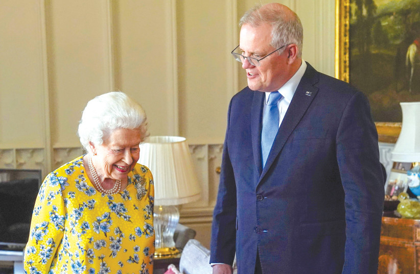  QUEEN ELIZABETH receives Australian Prime Minister Scott Morrison during an audience in the Oak Room at Windsor Castle, last year. (credit: Steve Parsons/Reuters)