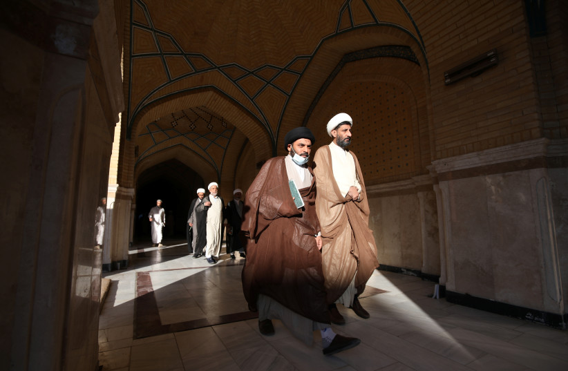  Shiite clerics walk inside the shrine of Imam Ali ,on the first time of religious school called (al-Hawza al-Ilmiyyah) reopening since the the coronavirus disease (COVID-19) outbreak, ,in the holy city of Najaf, Iraq November 10, 2021.  (photo credit: REUTERS/ALAA AL-MARJANI)