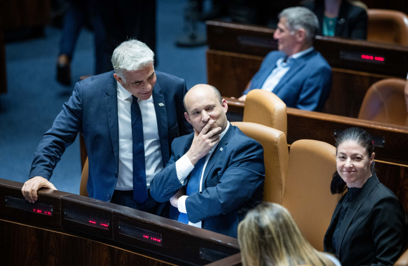 Prime Minister Naftali Bennett, Foreign Minister Yair Lapid and Transportation Minister Merav Michaeli voting at the Knesset on June 6, 2022 (credit: YONATAN SINDEL/FLASH90)