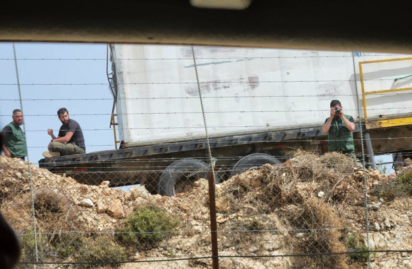 Alleged Hezbollah operatives at a Green Without Borders outpost the IDF says Hezbollah is using for reconnaissance (credit: IDF SPOKESPERSON'S UNIT)