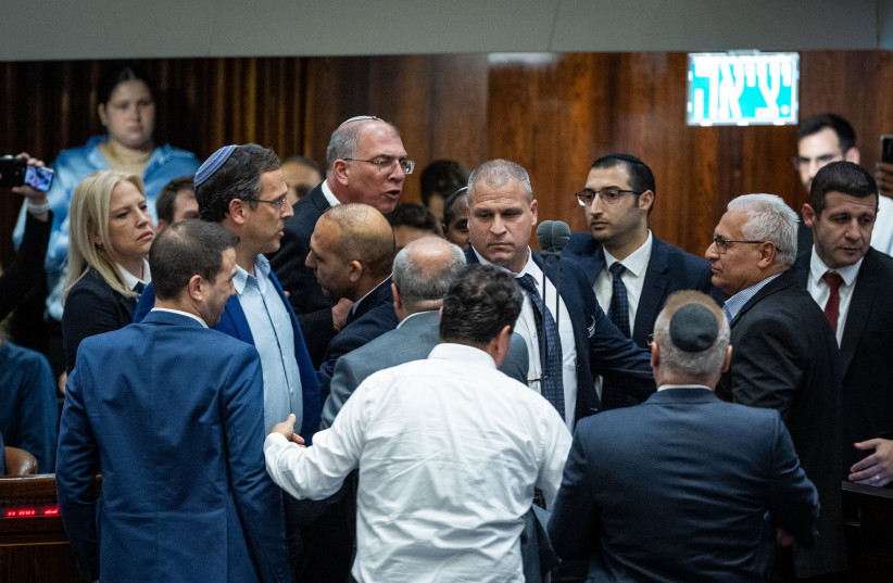  MK Mazen Ghanaim and MK Nir Orbach exchange words during a vote in the Knesset plenum on June 6, 2022 (photo credit: YONATAN SINDEL/FLASH90)