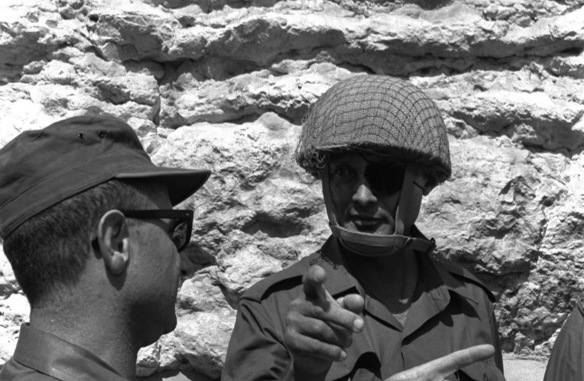  THEN-DEFENSE MINISTER Moshe Dayan (R) and Jerusalem commander Uzi Narkiss on the street leading to the Western Wall, June 7, 1967. (credit: ILAN BRUNER/GPO)