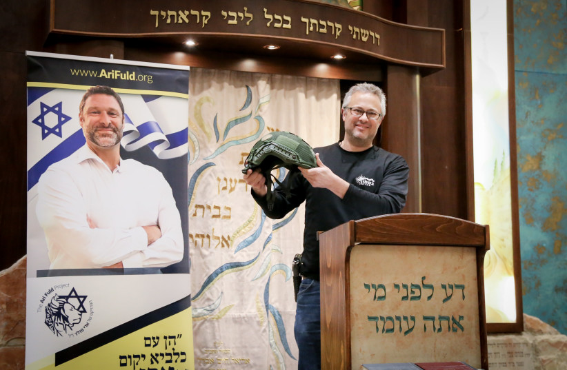 EFRAT’S STAND-BY platoon members in 2021 receive lightweight and anti-gunfire helmets donated in memory of Ari Fuld, murdered at Gush Etzion junction in 2018 (credit: GERSHON ELINSON/FLASH90)
