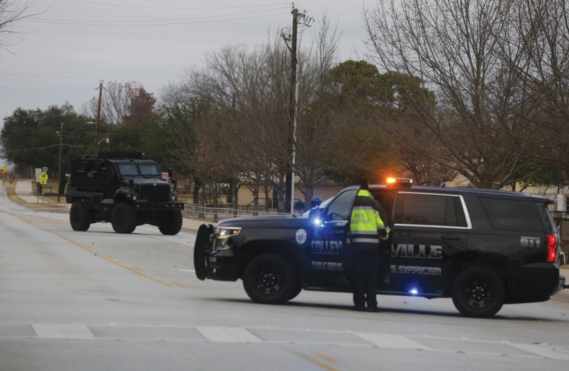  LAW ENFORCEMENT vehicles near a synagogue group taken hostage in Colleyville, Texas, this past January. The book’s author is the synagogue’s founder and a key spokeswoman regarding the incident.  (photo credit: Shelby Tauber/Reuters)
