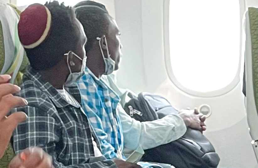  TWO OF the newest immigrants from Ethiopia pondering through the jetliner window about the past and anticipating their future. (photo credit: Charles O. Kaufman)